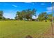 Spacious backyard with large trees and a fence at 1000 Se 155Th St, Summerfield, FL 34491