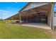 Large barn interior with concrete floor and high ceilings at 1000 Se 155Th St, Summerfield, FL 34491