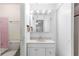 Clean bathroom with vanity, mirror, and shower/tub combo at 1000 Se 155Th St, Summerfield, FL 34491