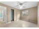 Bright bedroom with ceiling fan and built-in closet at 1000 Se 155Th St, Summerfield, FL 34491