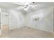 Simple bedroom with carpet flooring and ceiling fan at 1000 Se 155Th St, Summerfield, FL 34491