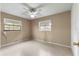 Bright bedroom with neutral walls and carpet flooring at 1000 Se 155Th St, Summerfield, FL 34491