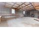 Workshop-style garage with shelves and overhead door at 1000 Se 155Th St, Summerfield, FL 34491