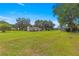 Ranch-style home on large lot with mature trees and detached barn at 1000 Se 155Th St, Summerfield, FL 34491