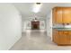 View from kitchen to living room with brick fireplace at 1000 Se 155Th St, Summerfield, FL 34491