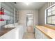 Laundry room with washer, dryer, and ample shelving at 1000 Se 155Th St, Summerfield, FL 34491