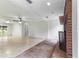Open living space featuring a brick fireplace and tile floor at 1000 Se 155Th St, Summerfield, FL 34491