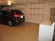 Garage with storage shelving and a vehicle at 11680 Sw 140Th Loop, Dunnellon, FL 34432