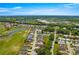 Aerial view of a home in a residential neighborhood, near a golf course at 17808 Se 115Th Ct, Summerfield, FL 34491