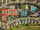 Aerial view of community tennis and pickleball courts, community pool and lush landscaping at 17808 Se 115Th Ct, Summerfield, FL 34491