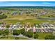 Aerial shot of a home near a golf course and other homes in the neighborhood at 17808 Se 115Th Ct, Summerfield, FL 34491