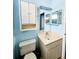 Bathroom with white fixtures and a built-in storage cabinet at 17808 Se 115Th Ct, Summerfield, FL 34491