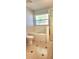 Bathroom featuring a soaking tub and glass-enclosed shower at 17808 Se 115Th Ct, Summerfield, FL 34491