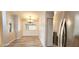 Bright dining room with wood floors and stainless steel refrigerator at 17808 Se 115Th Ct, Summerfield, FL 34491