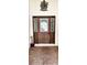 Charming front entrance featuring a decorative glass door with sidelights and brick pavers at 17808 Se 115Th Ct, Summerfield, FL 34491