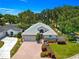 Charming home with a paved driveway, well-manicured lawn, and mature landscaping at 17808 Se 115Th Ct, Summerfield, FL 34491