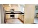 Modern kitchen with stainless steel appliances, ample cabinet space, and sleek granite countertops at 17808 Se 115Th Ct, Summerfield, FL 34491