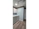 This laundry room has a washer, dryer, light blue paint, and cabinets at 17808 Se 115Th Ct, Summerfield, FL 34491