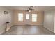 Inviting living room with bright windows and sliding glass door with neutral paint palette at 17808 Se 115Th Ct, Summerfield, FL 34491