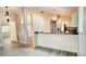Open-concept living room and kitchen with granite countertops at 17808 Se 115Th Ct, Summerfield, FL 34491