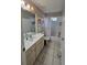 Bathroom featuring a tiled floor, bathtub with a shower, and a vanity with a sink at 5650 Se 34Th St, Ocala, FL 34480
