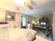 Cozy bedroom featuring a comfortable bed and a workspace, offering relaxation and productivity at 5650 Se 34Th St, Ocala, FL 34480