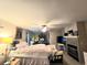 Spacious bedroom featuring a fireplace and a bed, providing a comfortable and cozy atmosphere at 5650 Se 34Th St, Ocala, FL 34480