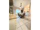 Dining area featuring a table with four chairs, a china cabinet, and a large window at 5650 Se 34Th St, Ocala, FL 34480