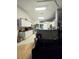Kitchen featuring white cabinets, black countertops, and stainless steel appliances at 5650 Se 34Th St, Ocala, FL 34480