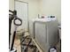 Well-lit laundry room with tile floor, washer, and dryer at 5650 Se 34Th St, Ocala, FL 34480