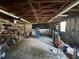 Unfinished garage space with exposed rafters and concrete floor at 5877 Nw 64Th St, Ocala, FL 34482