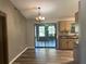 The kitchen features a sliding glass door, ample counter space and plenty of natural light at 5877 Nw 64Th St, Ocala, FL 34482