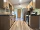 A cozy kitchen features stainless steel appliances, ample cabinet space, and modern countertops at 5877 Nw 64Th St, Ocala, FL 34482