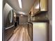 This spacious kitchen features stainless appliances, ample counter space and natural light at 5877 Nw 64Th St, Ocala, FL 34482