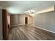 Open-concept living area with wood floors and natural light at 5877 Nw 64Th St, Ocala, FL 34482