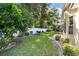 Landscaped backyard features a privacy fence and lush greenery at 11017 Sw 71St Cir, Ocala, FL 34476