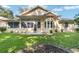 Back of home features a well maintained lawn and sunroom at 11017 Sw 71St Cir, Ocala, FL 34476