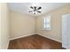 Comfortable bedroom with ceiling fan and window offering natural light at 11017 Sw 71St Cir, Ocala, FL 34476