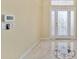 Foyer with tile flooring and decorative glass front door at 11017 Sw 71St Cir, Ocala, FL 34476