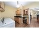 Well-equipped laundry room with cabinetry, countertop, and task lighting at 11017 Sw 71St Cir, Ocala, FL 34476