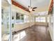 Enclosed sunroom provides a tranquil space with natural light and tiled floors at 11017 Sw 71St Cir, Ocala, FL 34476