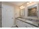 Bathroom featuring double sinks with granite countertops and tiled shower at 4519 Sw 111Th Pl, Ocala, FL 34476