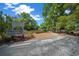 Fenced dog park with shade trees and benches, ideal for pet owners at 10820 Sw 87Th Ter, Ocala, FL 34481