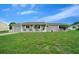 Cozy single-story home with a well-manicured lawn and charming white picket fence in daylight at 10820 Sw 87Th Ter, Ocala, FL 34481