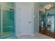 Bright bathroom features a walk-in shower and an entrance to the main part of the house at 15268 Sw 14Th Avenue Rd, Ocala, FL 34473