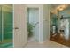 Bright bathroom features a walk-in shower and a view of a private toilet room at 15268 Sw 14Th Avenue Rd, Ocala, FL 34473
