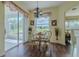 Cozy breakfast nook with a glass table, backyard views and elegant chandelier at 15268 Sw 14Th Avenue Rd, Ocala, FL 34473