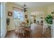 Charming dining area with backyard view and chandelier, adjacent to the kitchen and living room at 15268 Sw 14Th Avenue Rd, Ocala, FL 34473
