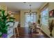 A breakfast nook with a backyard view is adjacent to the kitchen and living room at 15268 Sw 14Th Avenue Rd, Ocala, FL 34473