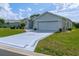 Lovely single story home with a stylish decorative driveway and a two-car garage at 15268 Sw 14Th Avenue Rd, Ocala, FL 34473
